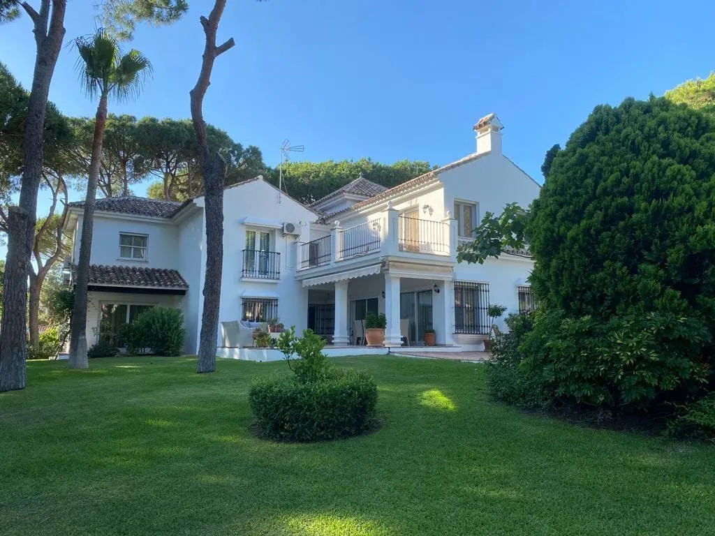 A cosy family villa set within a mature Mediterranean garden — exterior view, Marbella Este.
